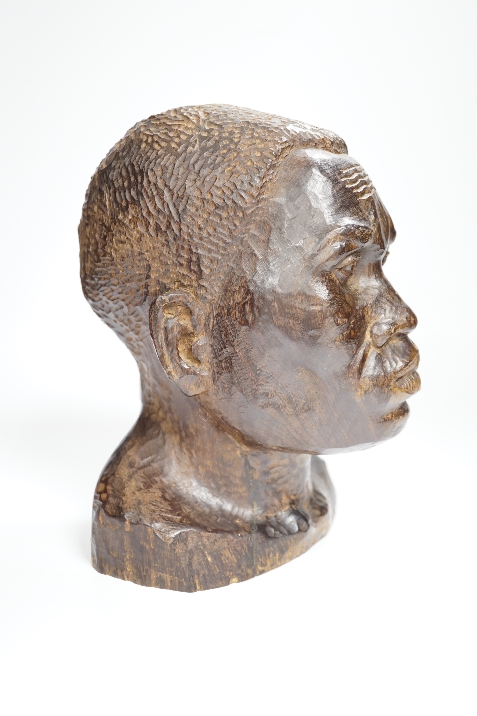 An African carved ebony bust of a gentleman, incised Silas to base, 24cm high